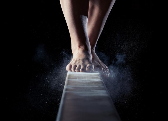 Feet on a gymnastics beam