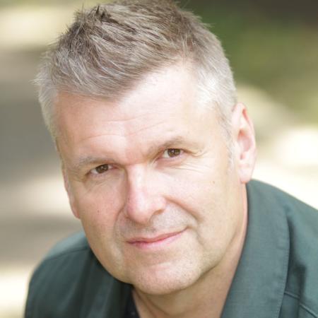 Photograph of Phil Corbitt looking to camera