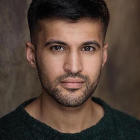 Headshot of actor Qasim Mahmood