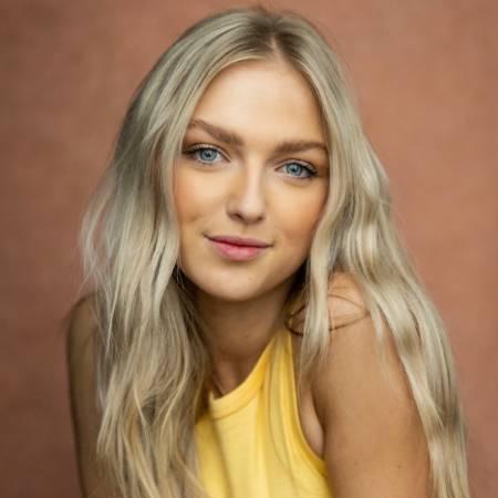 Portrait photograph of Emily Ash looking to camera