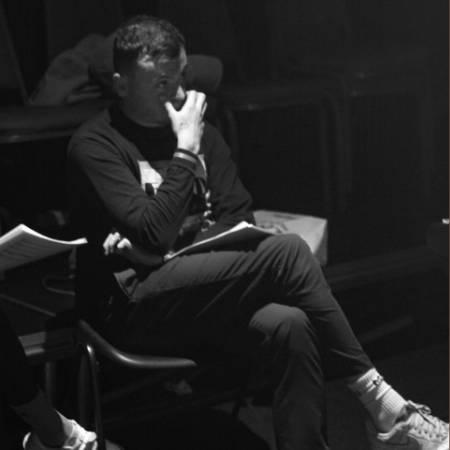 Jamie Eastlake seated with legs crossed