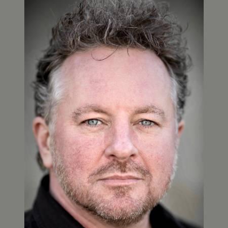 Portrait photograph of Joe Caffrey looking to camera