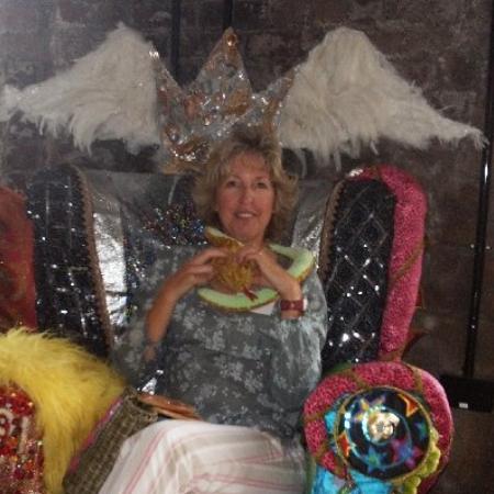 Alison Ashcroft sitting in an ornate storytelling chair