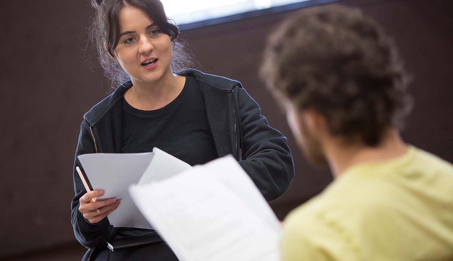 Introduction to playwriting image of two actors reading scripts