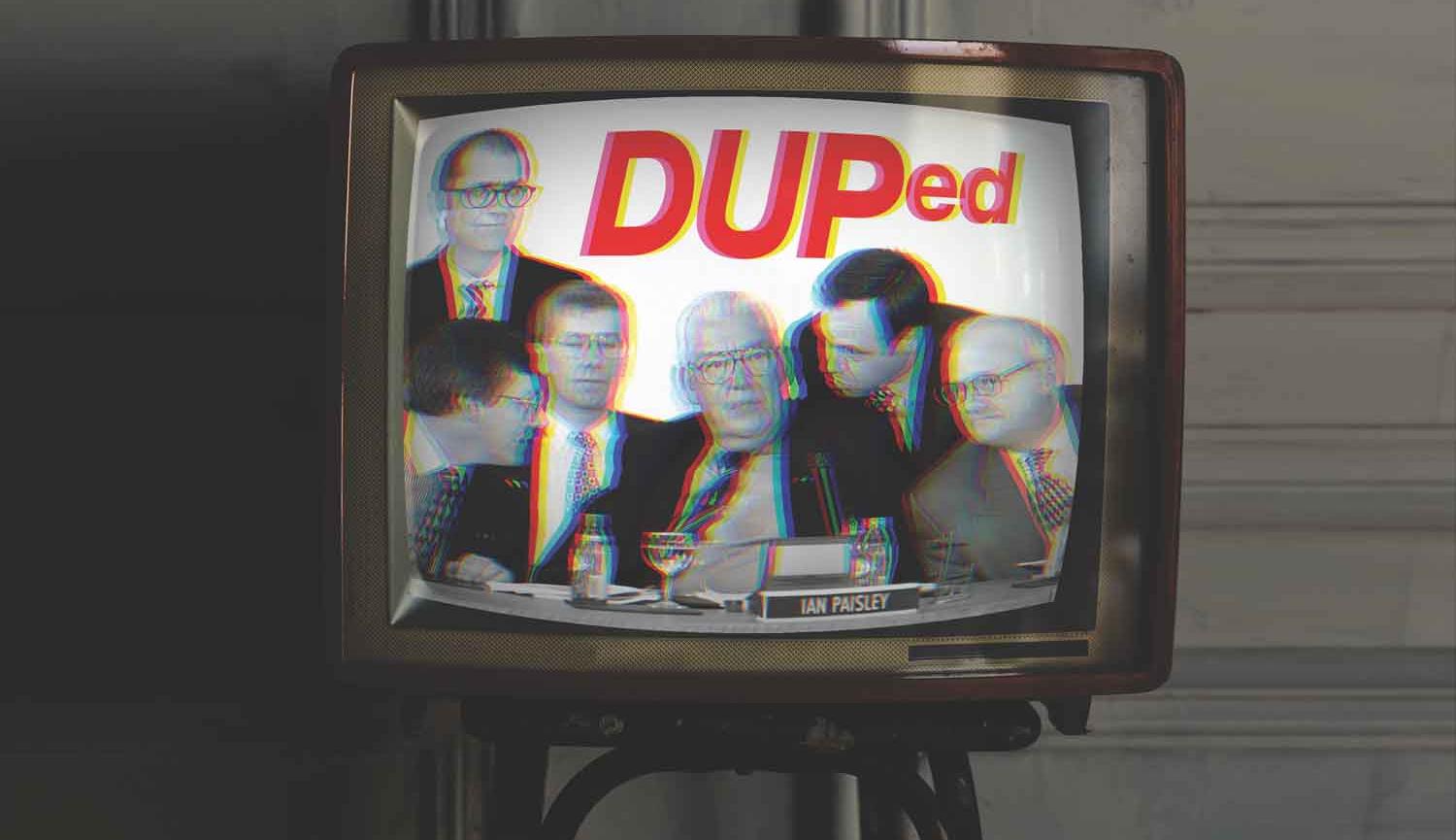 Photo of old style TV with Ian Paisley surrounded by five men on the screen