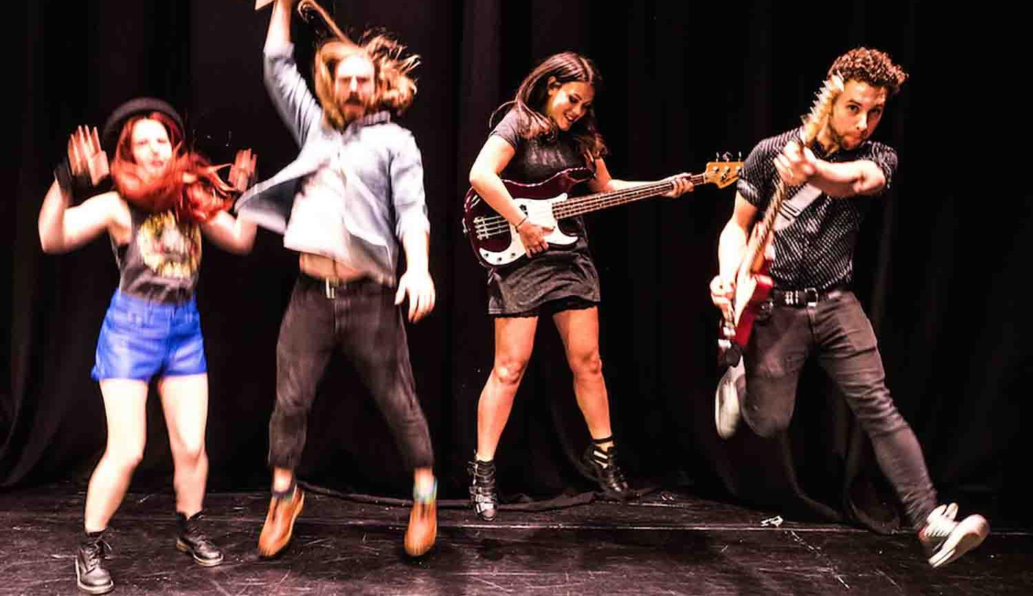 Fans image four musicians leaping in the air