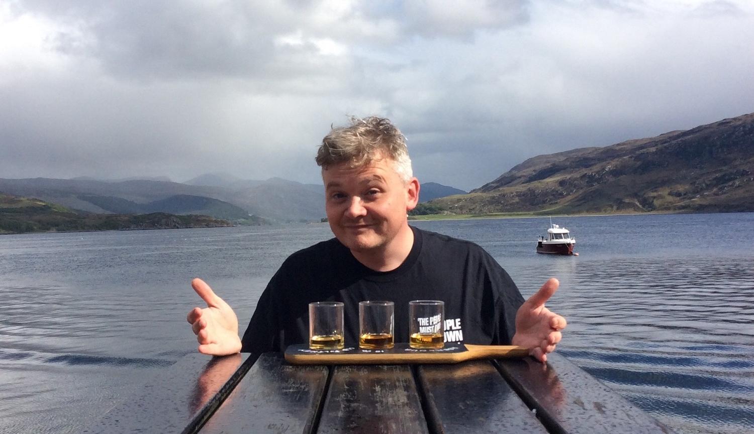 Joe Douglas by Loch with Whisky taster glasses