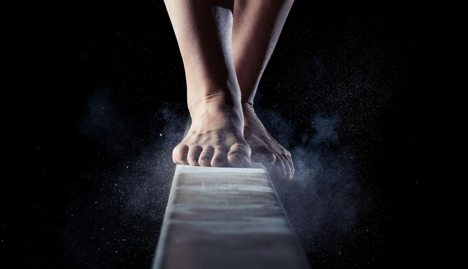 Rattlesnake image, feet on gym beam