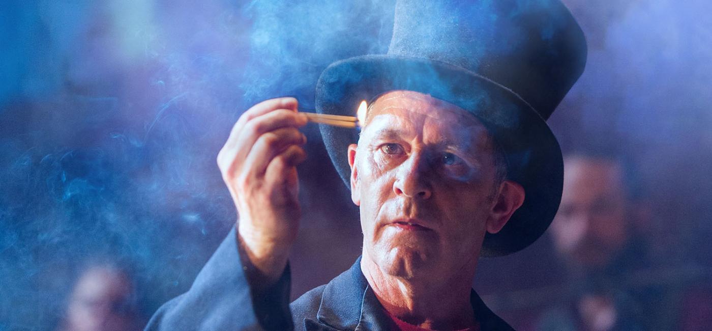 Man with top hat and match