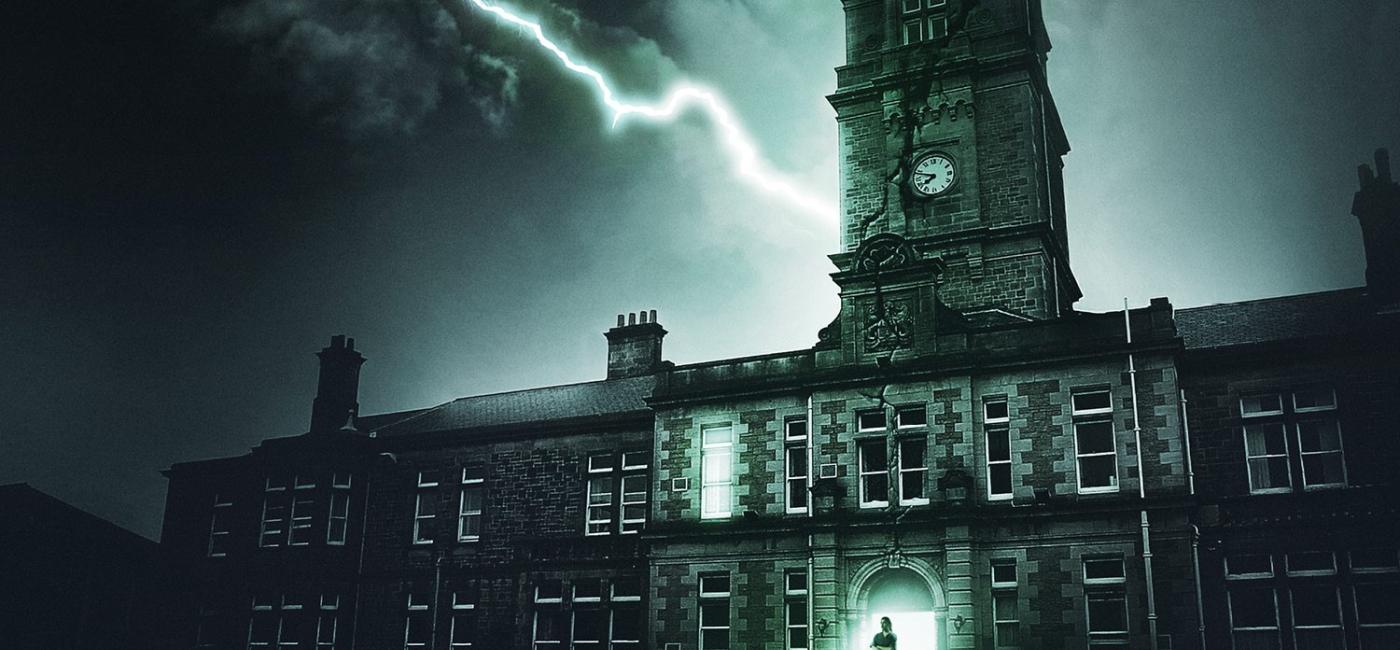 Image of St. Nicholas hospital at night with lightning