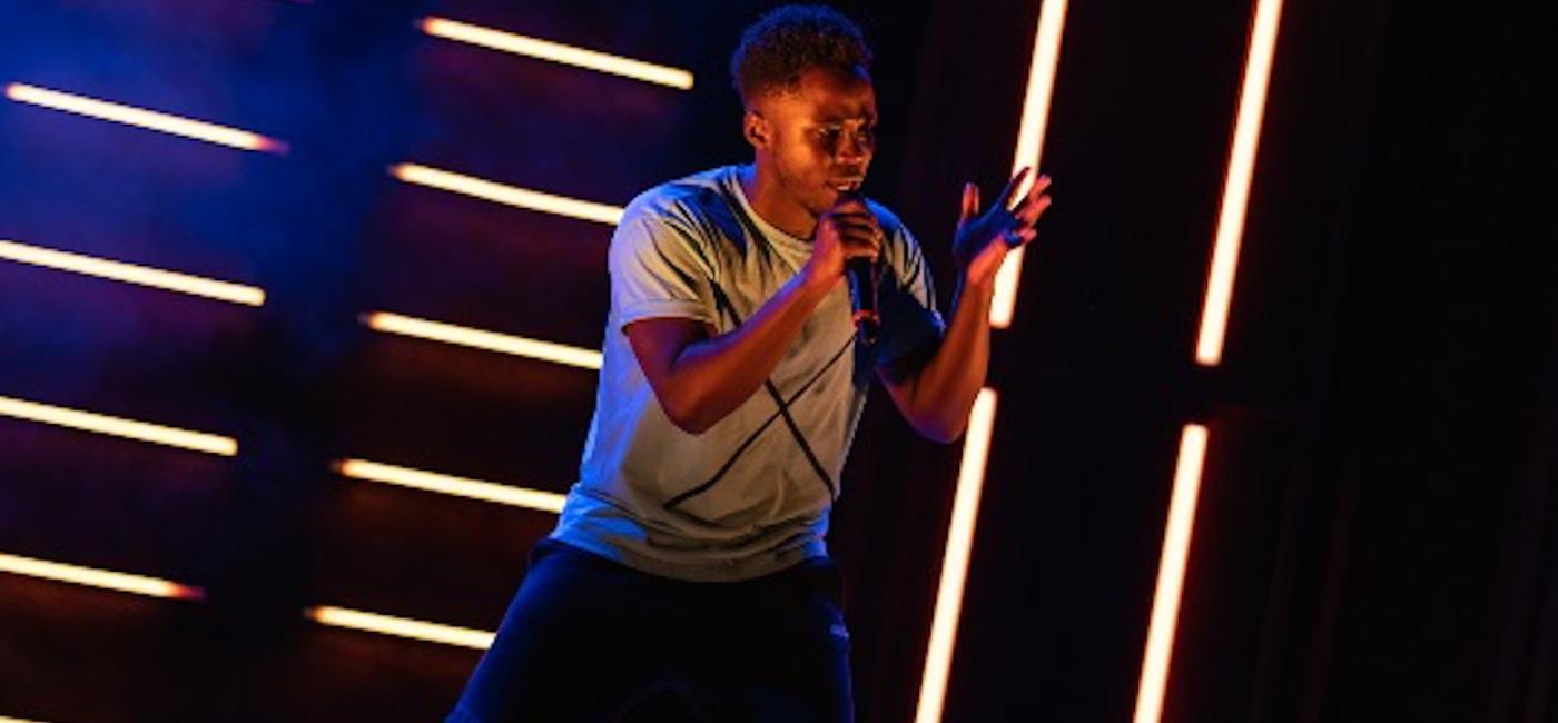 Young man on stage with microphone