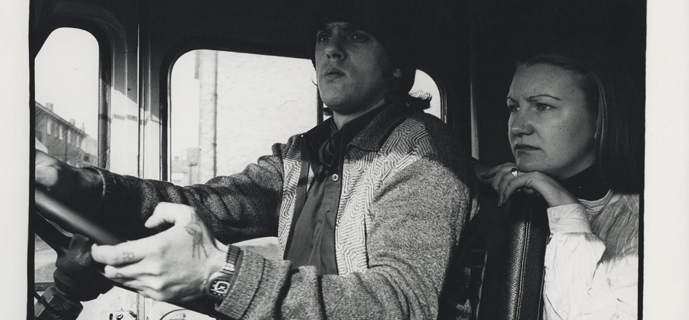 Photo from 1970s of man and woman driving van 