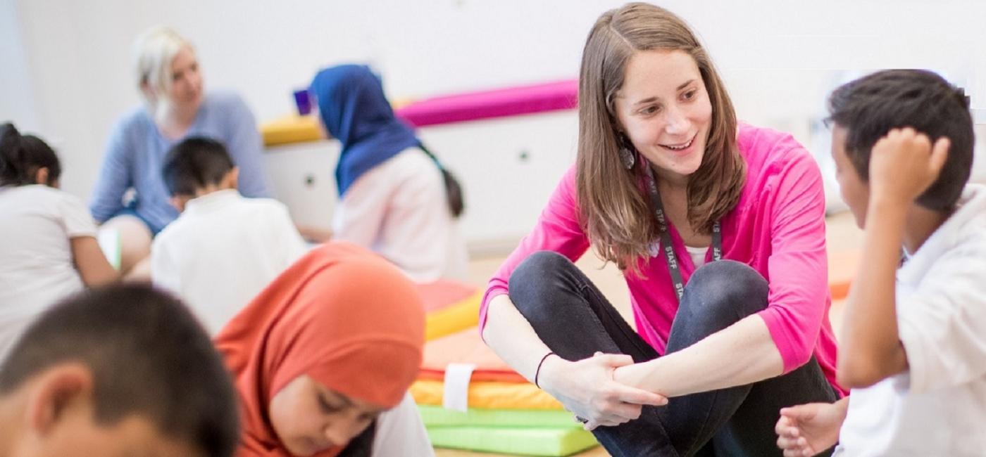 Christina Castling project lead for Live Tales with pupils enjoying a story writing workshop