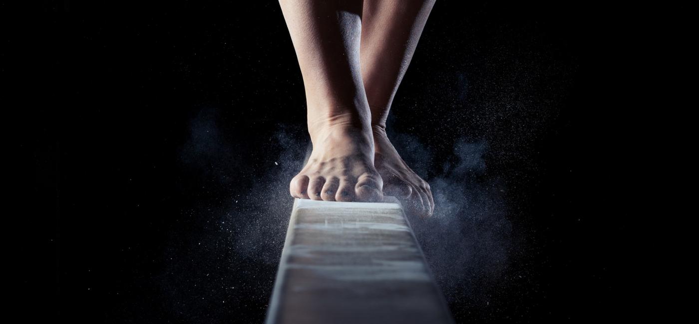 Image of feet walking on a barre