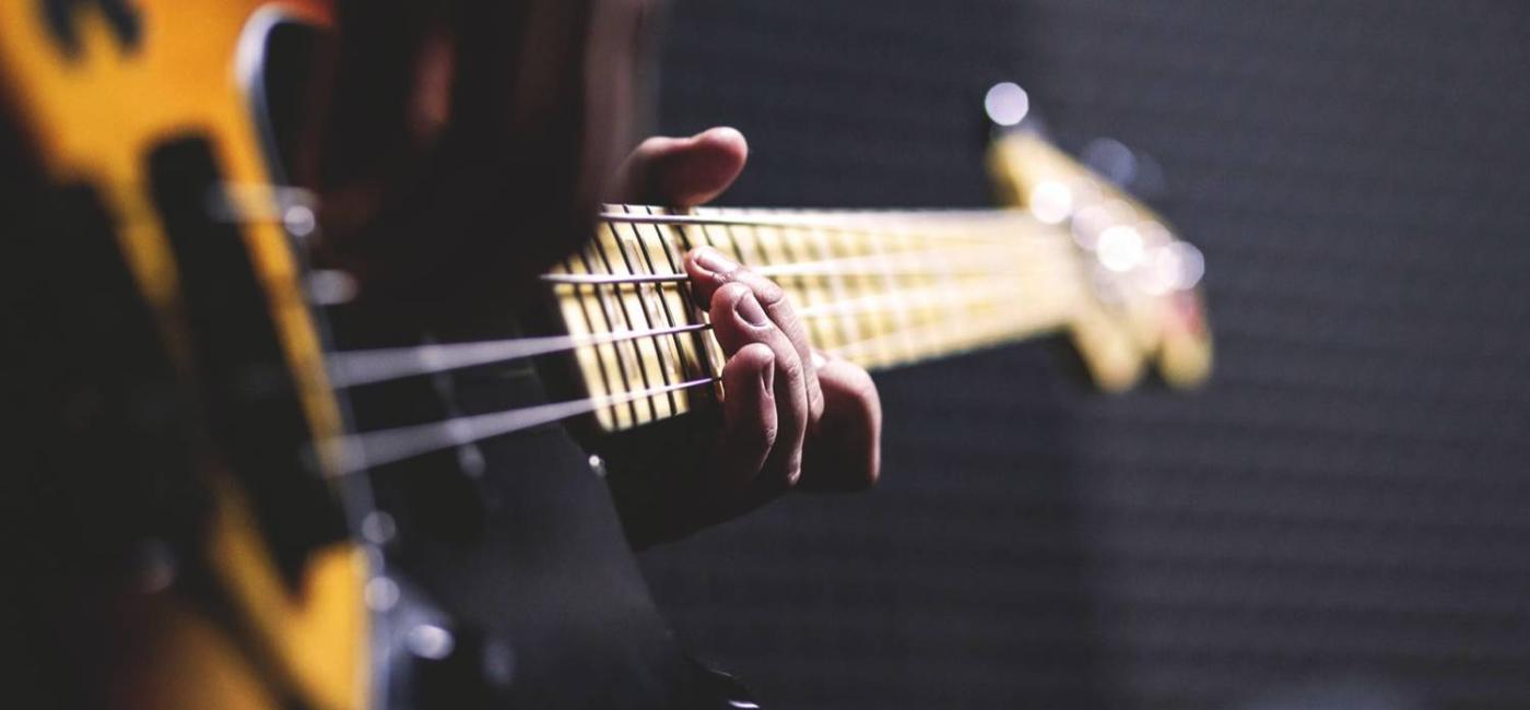 A person playing a guitar