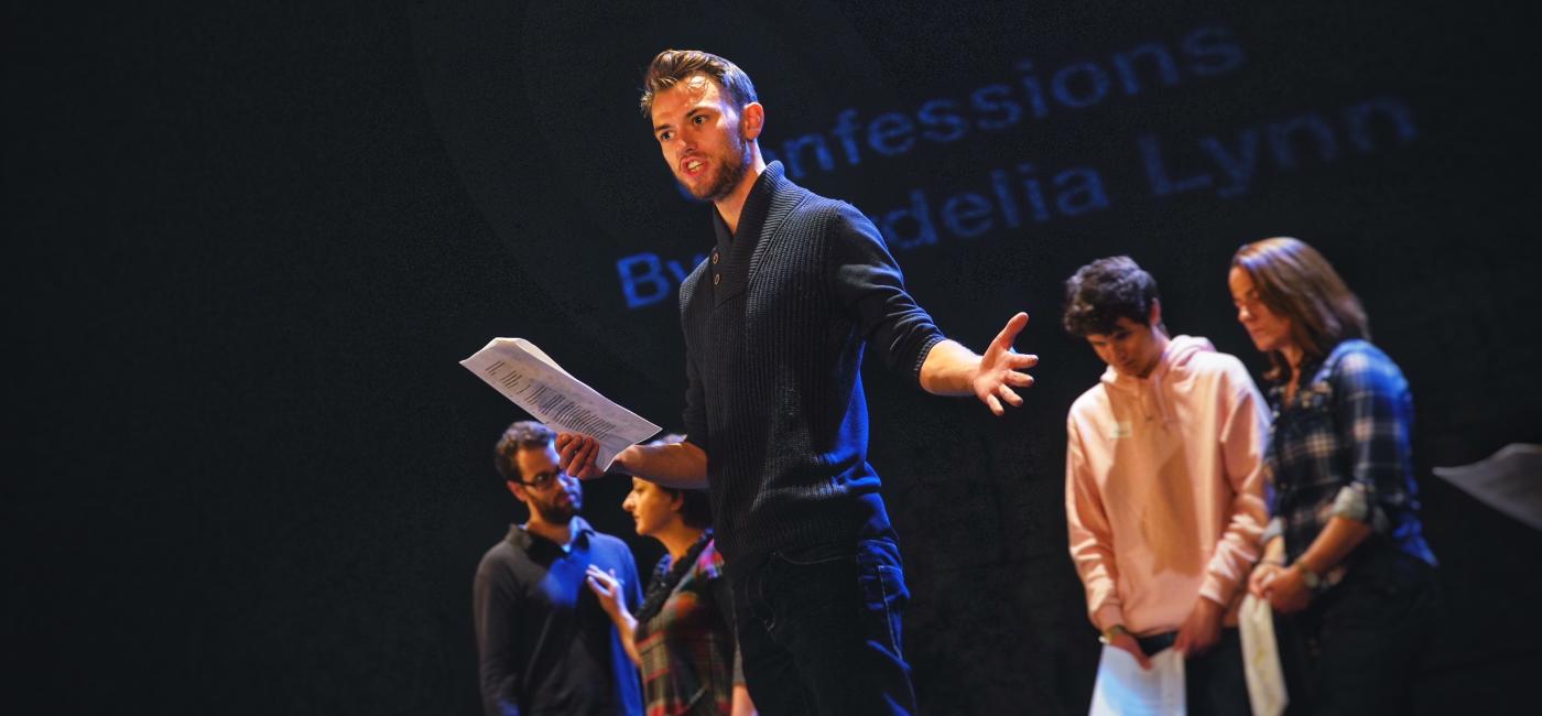 Young people speaking on stage 