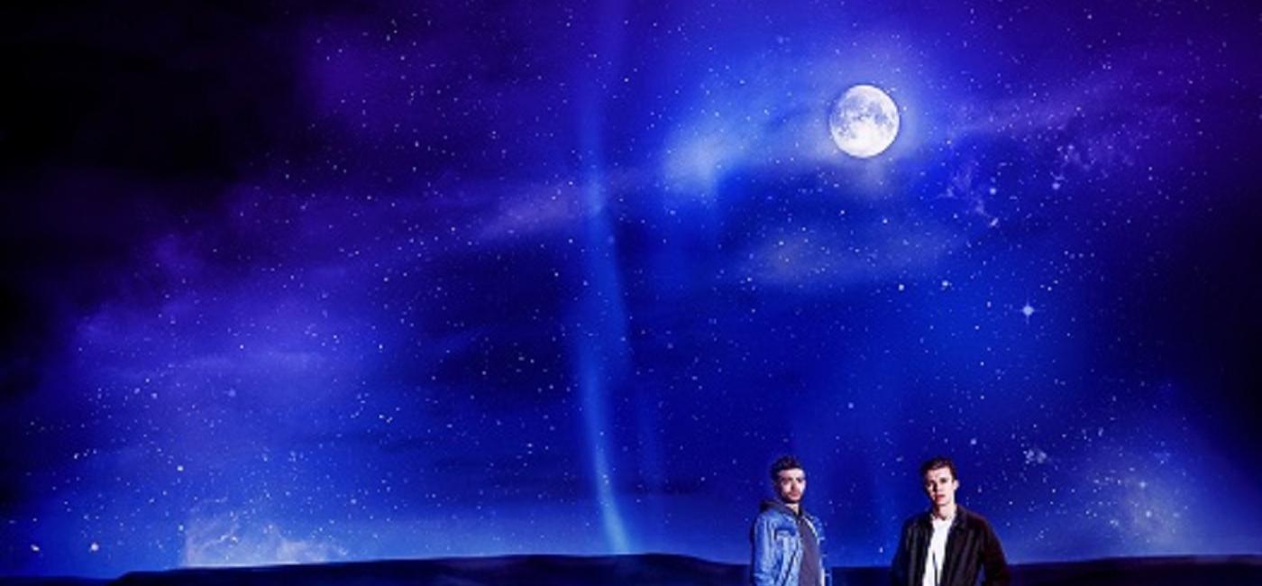 2 men standing underneath the moon - Under Three Moons