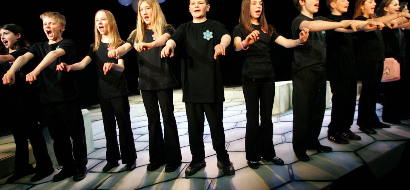 Artsmark, group of children on stage