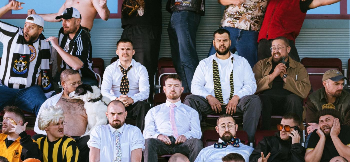 Metroland Comedy members in a football stand