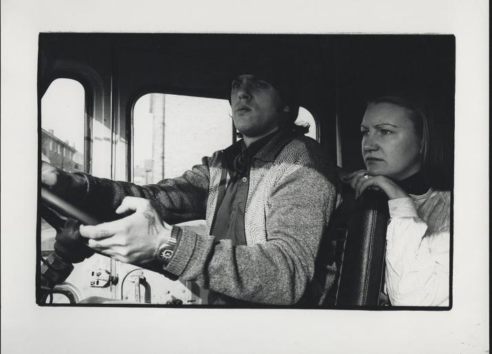 Photo from 1970s of man and woman driving van 