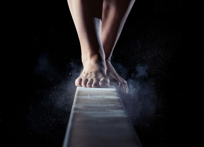 Rattlesnake image, feet on gym beam