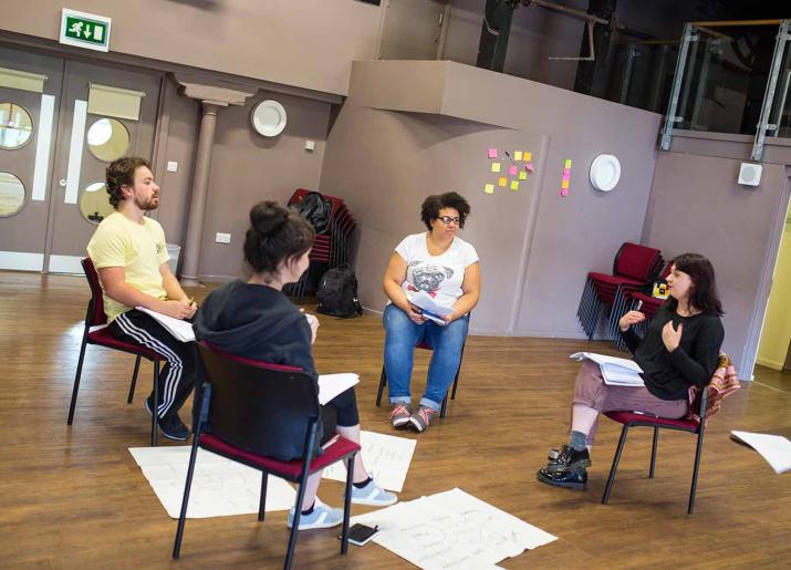 Women and the world image of women siting on chairs in a circle