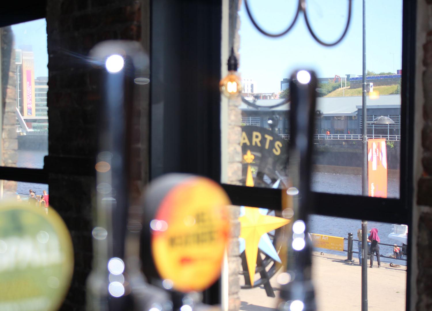 View through bar pumps to Quayside 